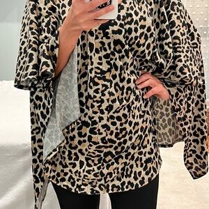 Dress up! Large Leopard poncho! Great over anything! V neck gives it flow!
